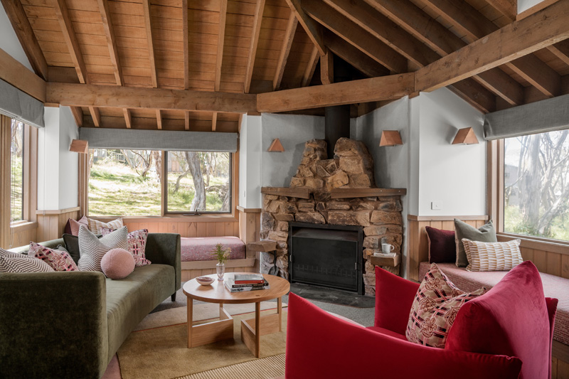 Modern living room at Blairs Chalet Dinner Plain by architect Britt White Studios Bright with open fireplace