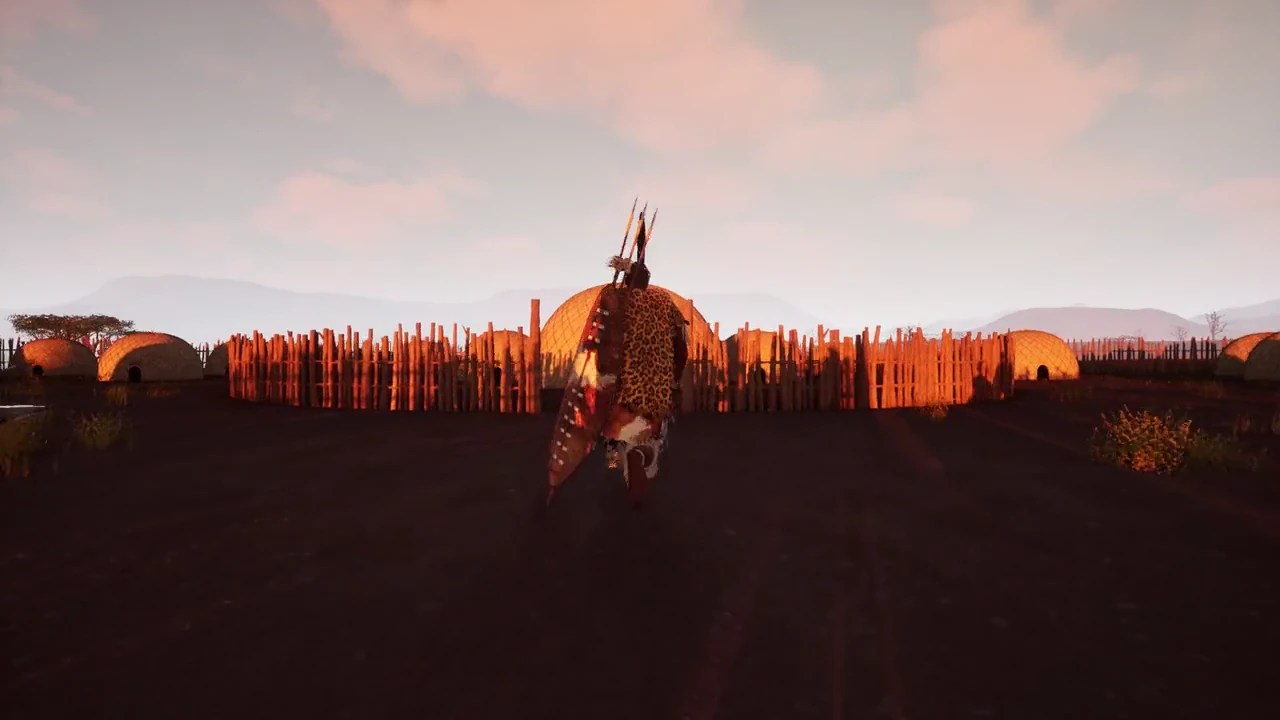 Shaka approaches a settlement in warm evening light.