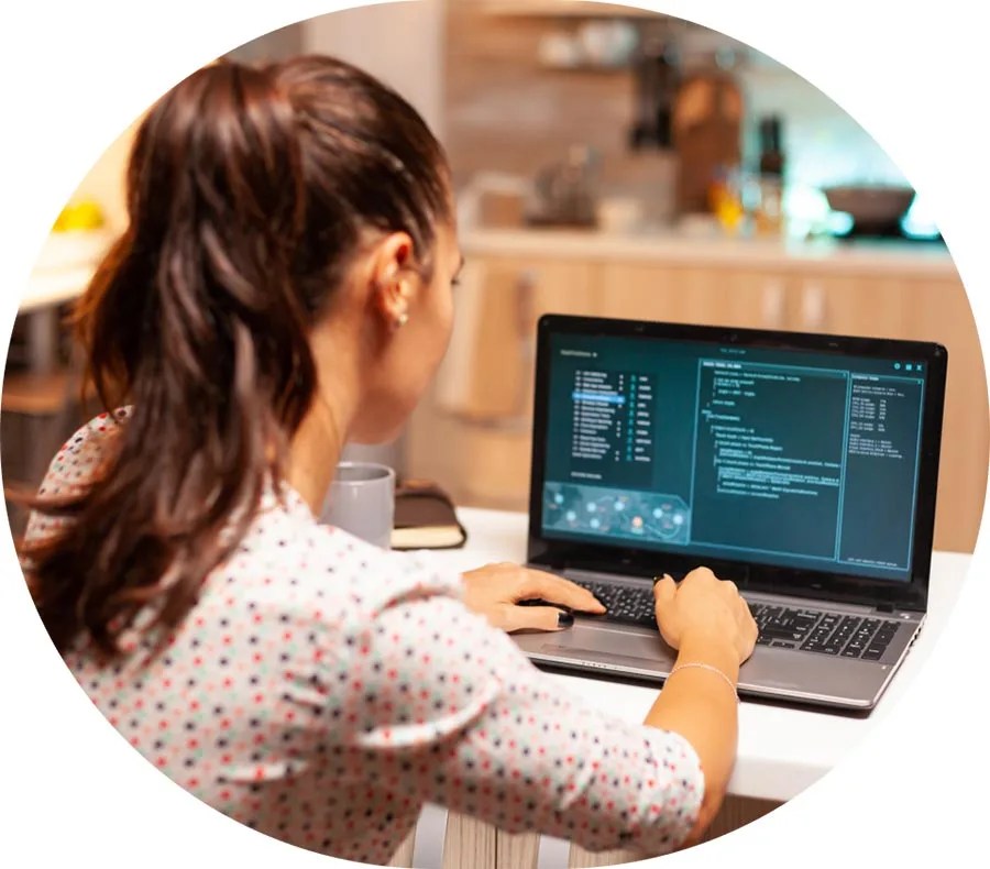 Person coding on laptop