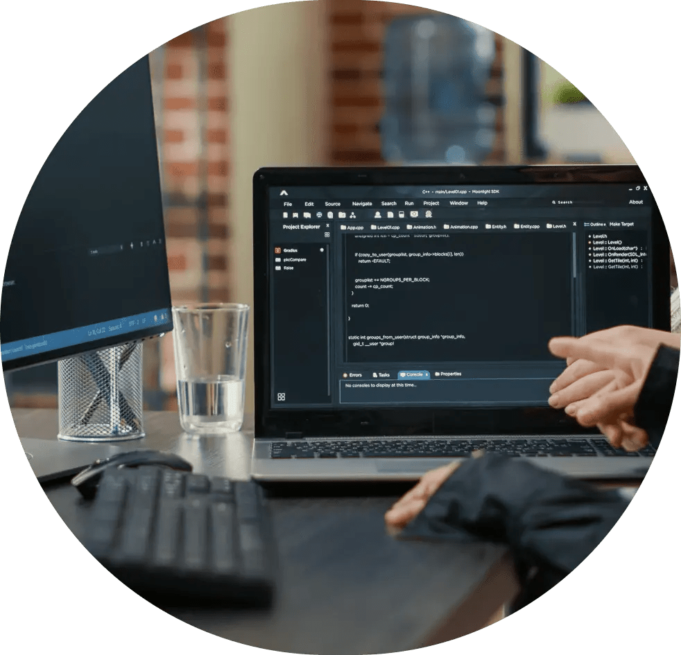 Person coding on a laptop.