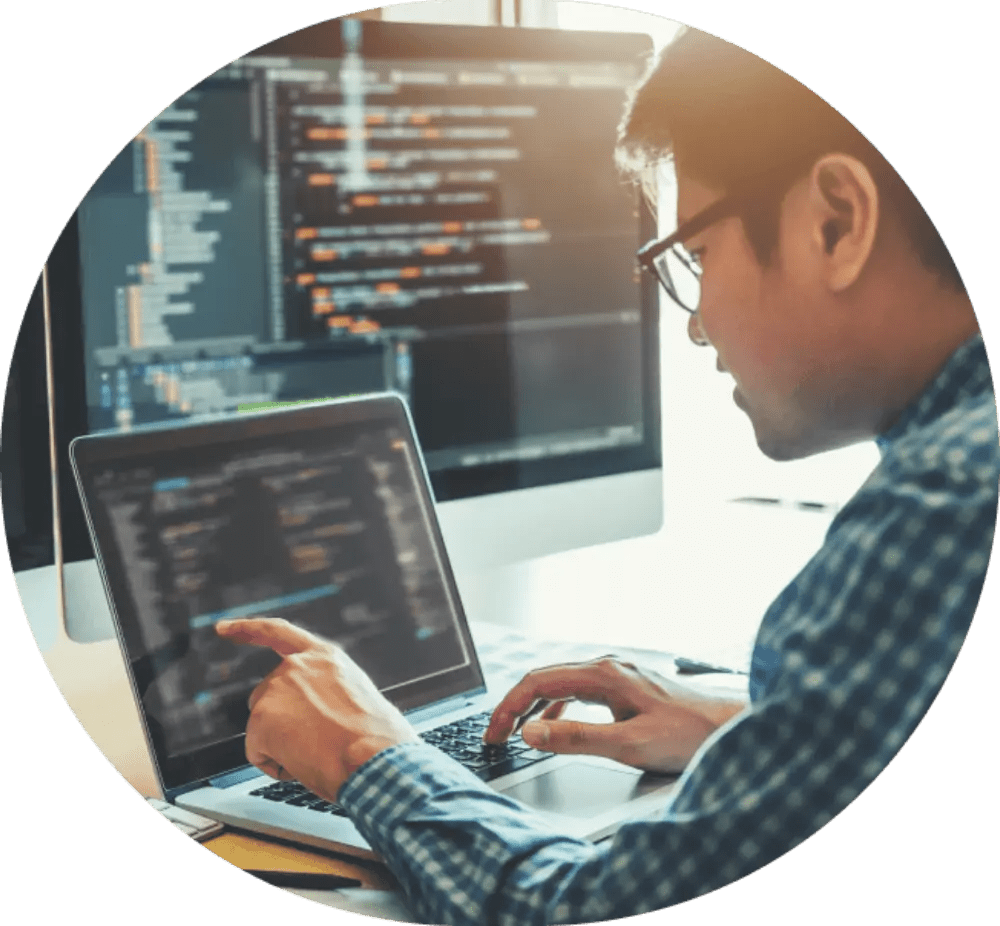 Person coding on laptop