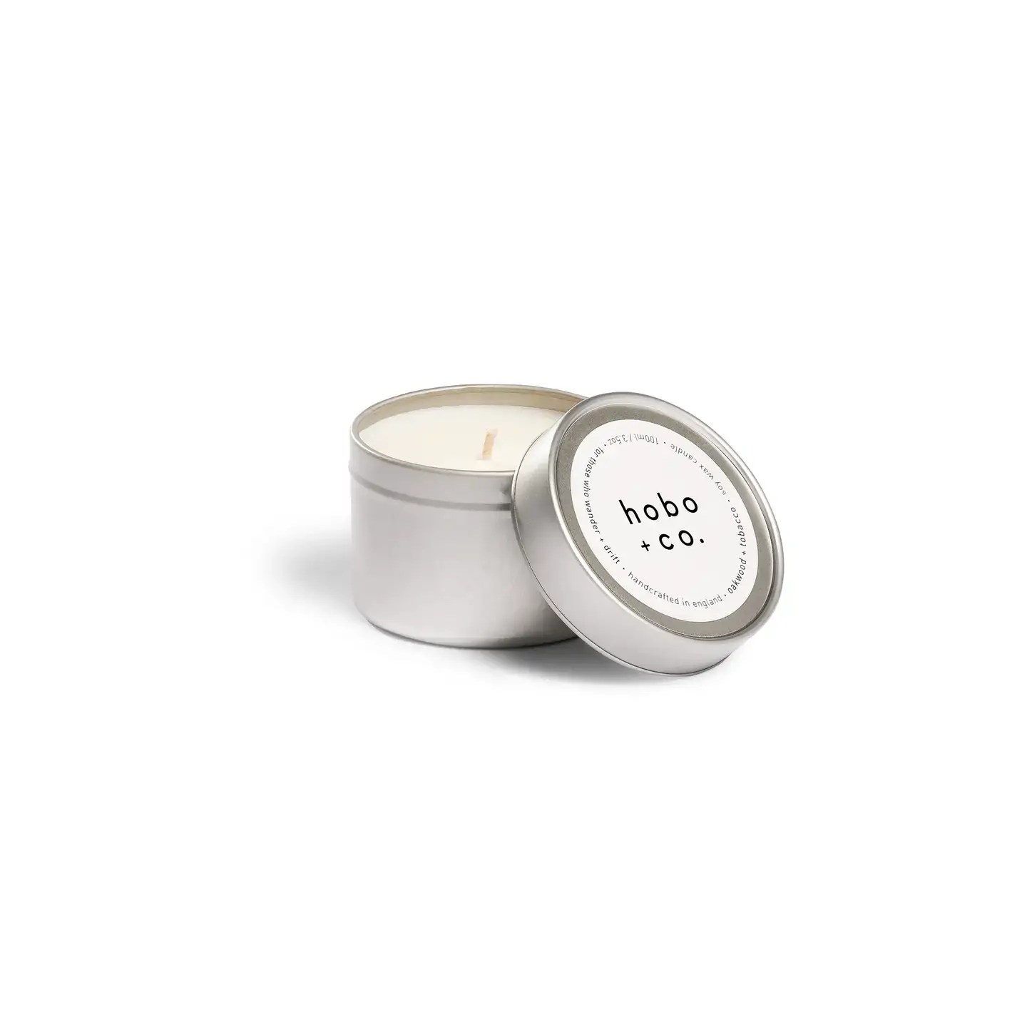 Soy wax candle in minimalist silver tin with lid, handcrafted in England.