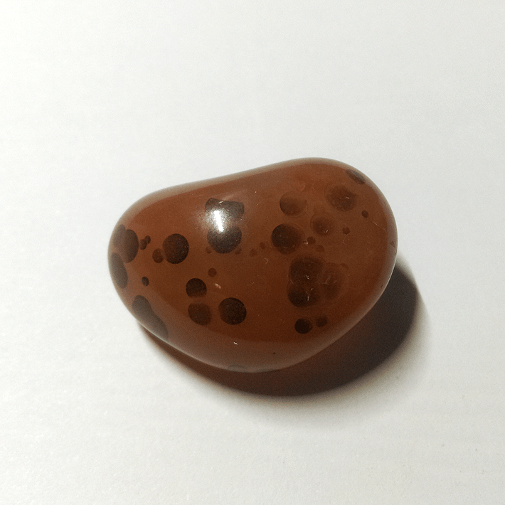 Could have been Eye Agate, but it was tumbled too deep.