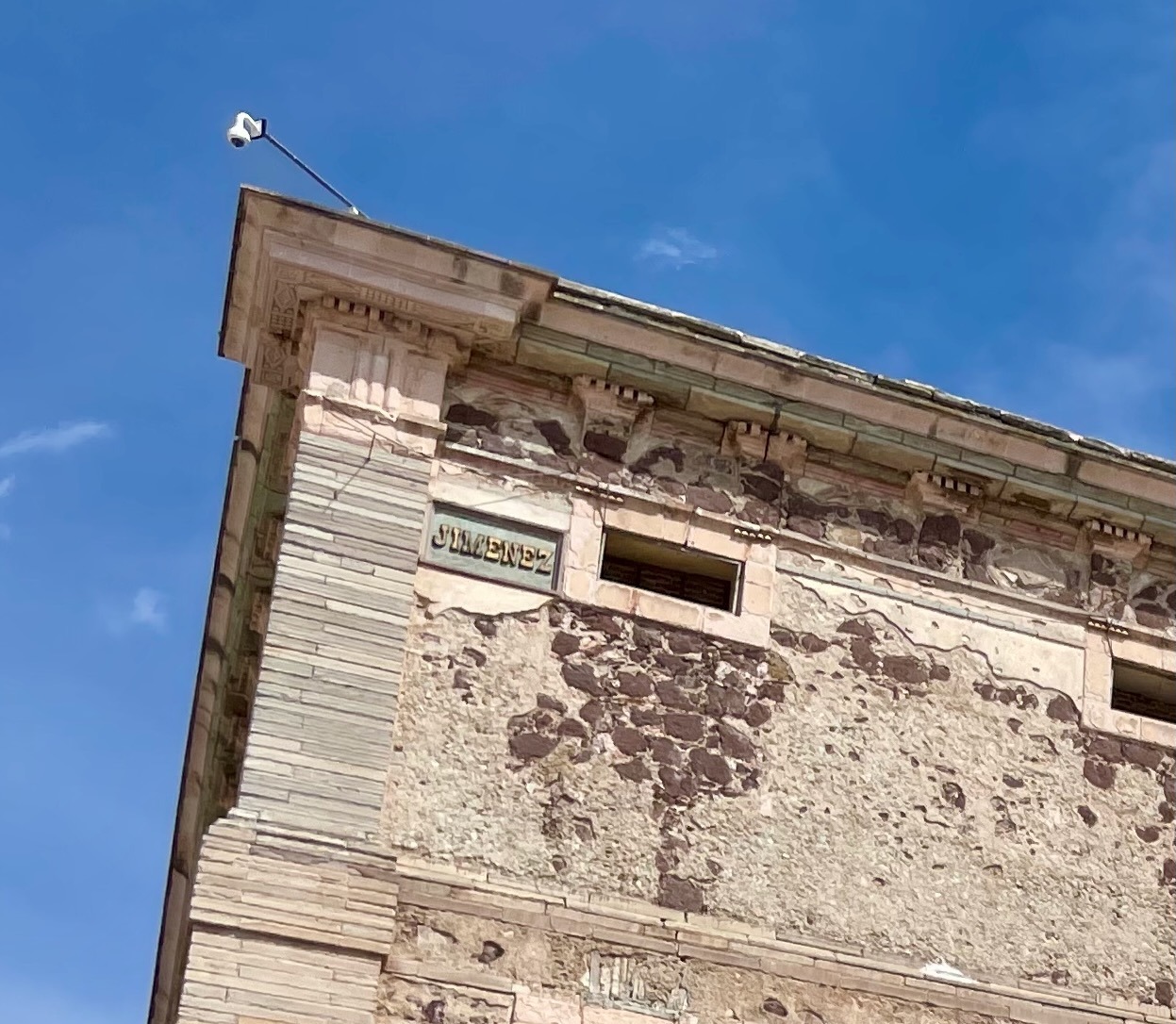 Each of the building's four corners is inscribed with the name of the person whose head dangled there. In this case, Jimenez.