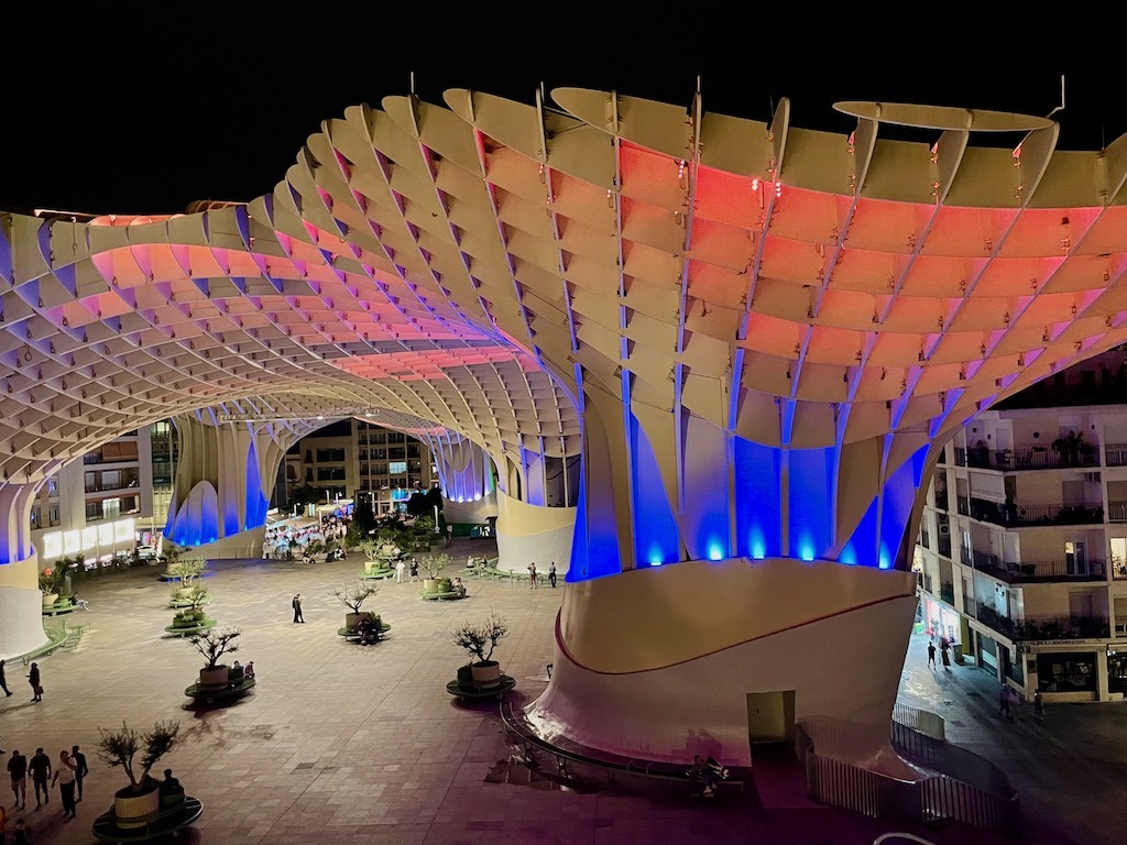 Underneath is a broad plaza that hosts a traditional market during the day.