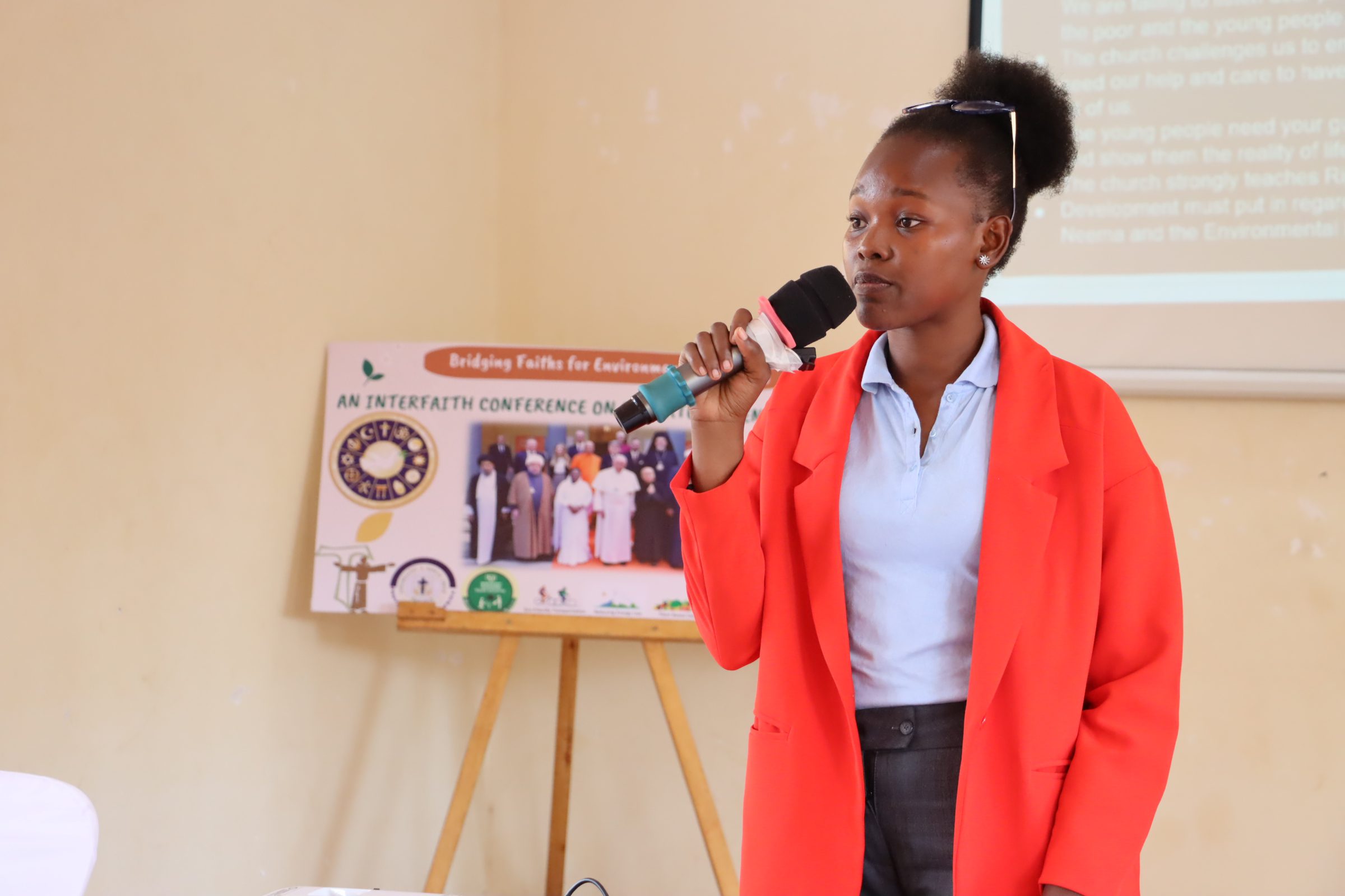 Our Laudato Clubs President Sarah Kirikumwino at the Interfaith Conference on Climate and Environment