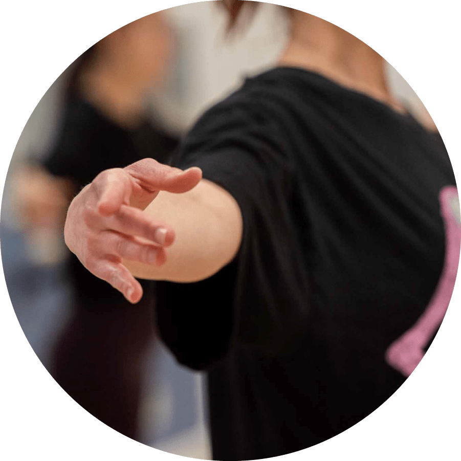 dancer's arm wearing t-shirt