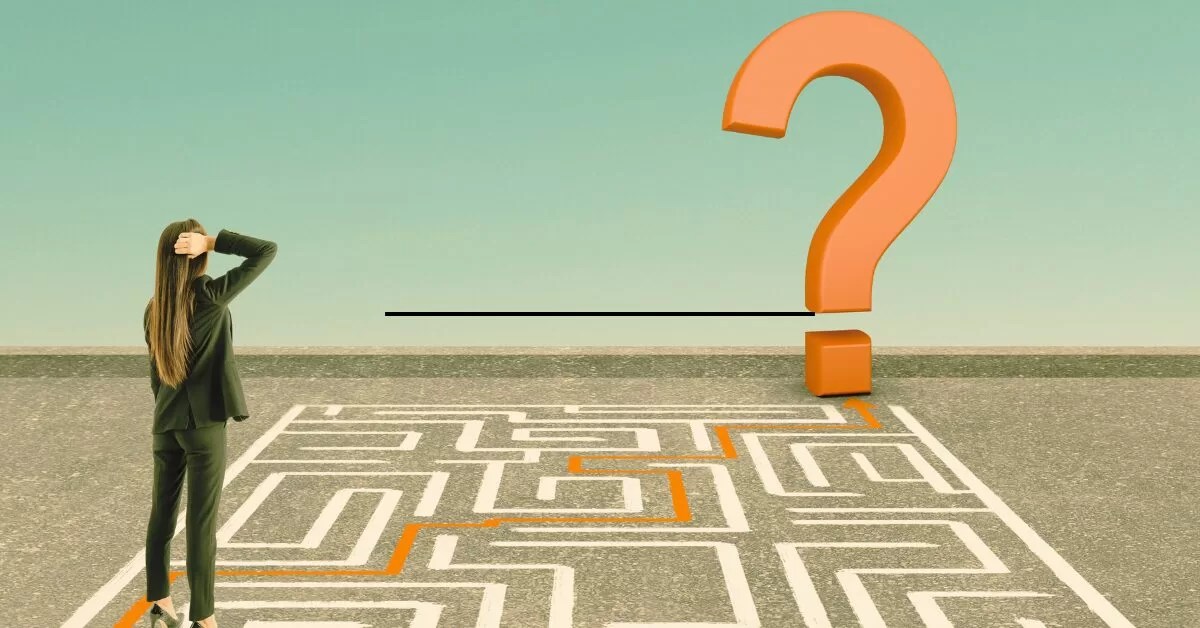 woman from behind in suit scratching head a maze in front of her and a giant orange question mark at one end of the maze depicting navigating challenges