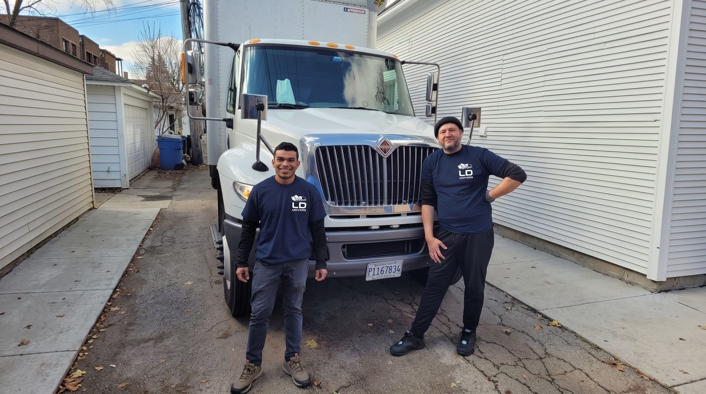 LD Movers crew with white truck ready for delivery