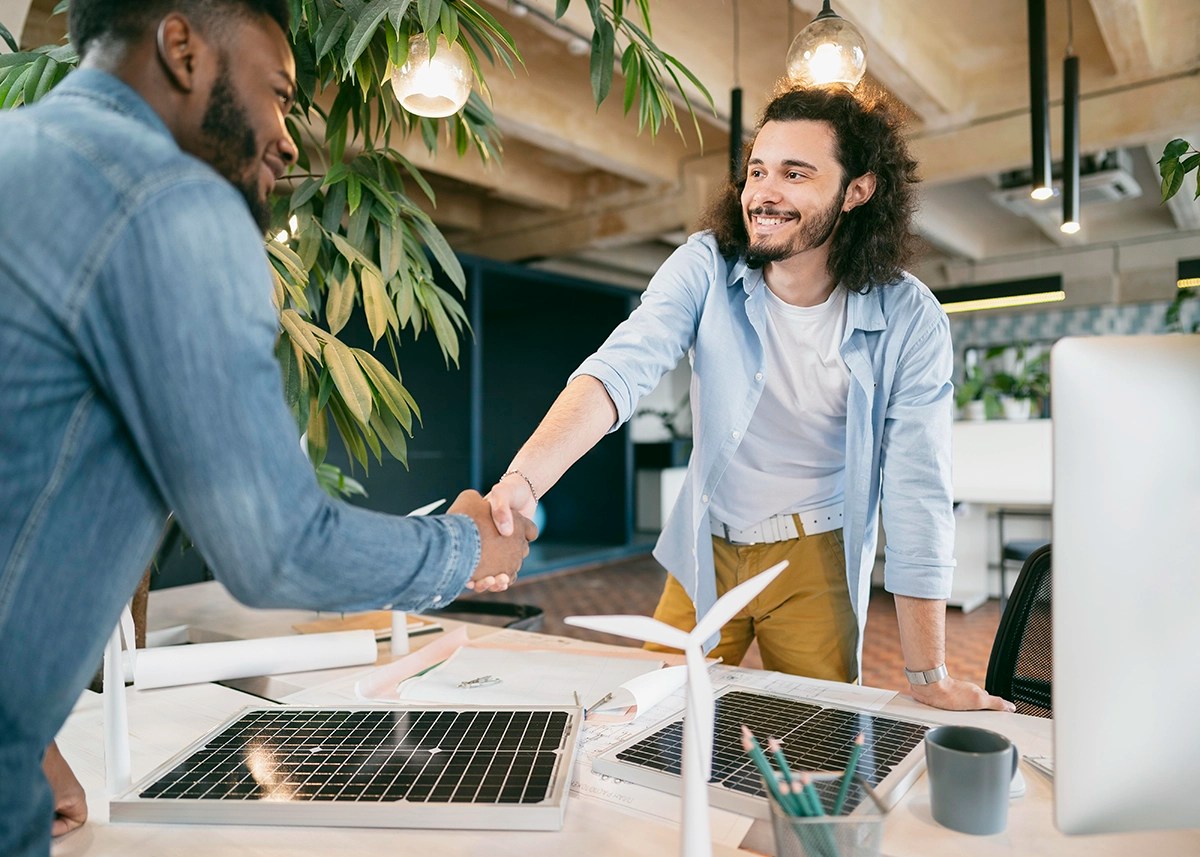 LD Creative Designs - Maximize Your Website's Potential - New client shaking hands with business owner