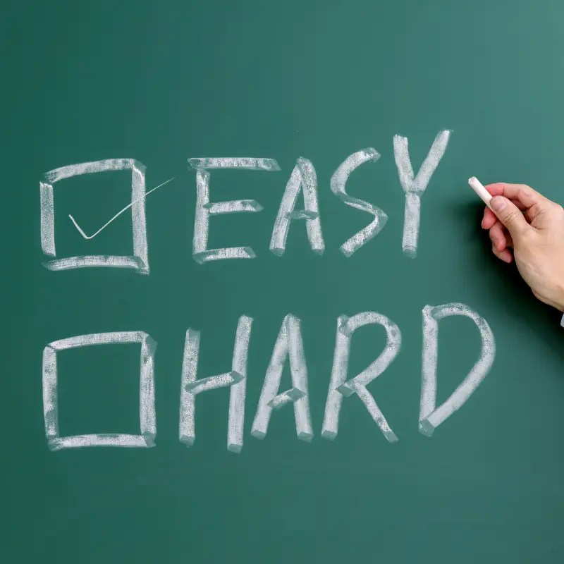 Chalk board with easy and hard written on there. Easy has a check mark by it because LDI Pro Printing makes printing easy.