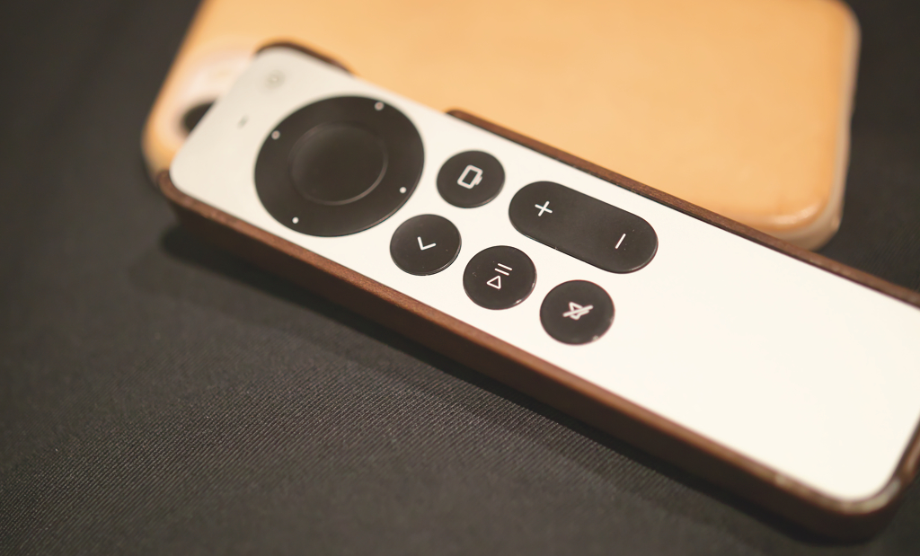 Nomad's Apple remote case along with their iPhone case in the background.