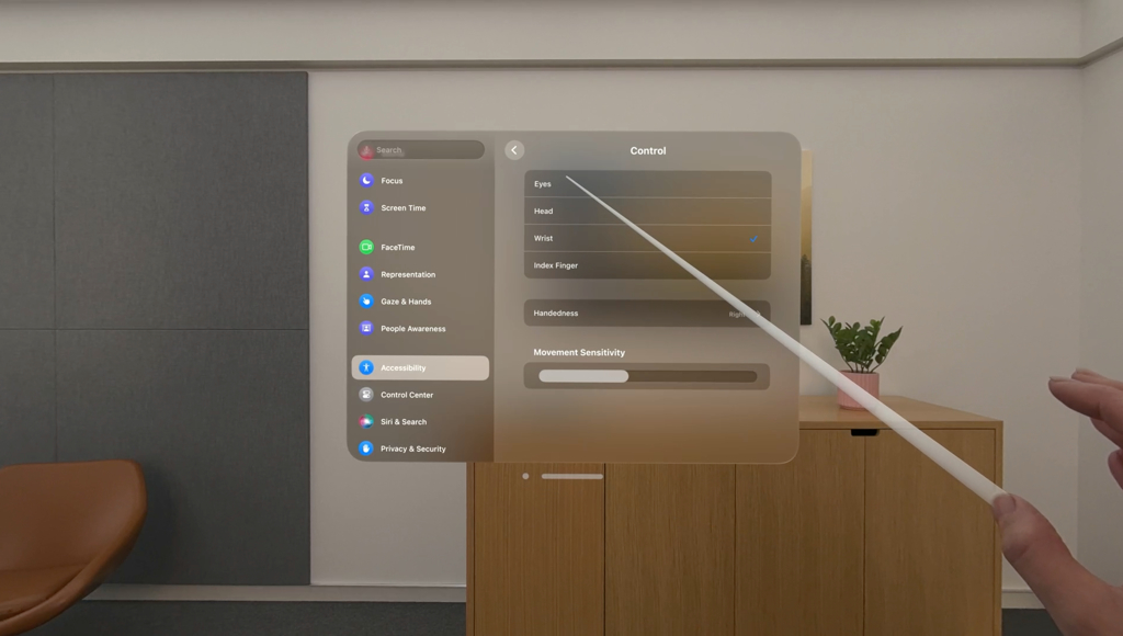 Vision Pro UI mockup showing using your hand to point to UI elements instead of eye tracking.