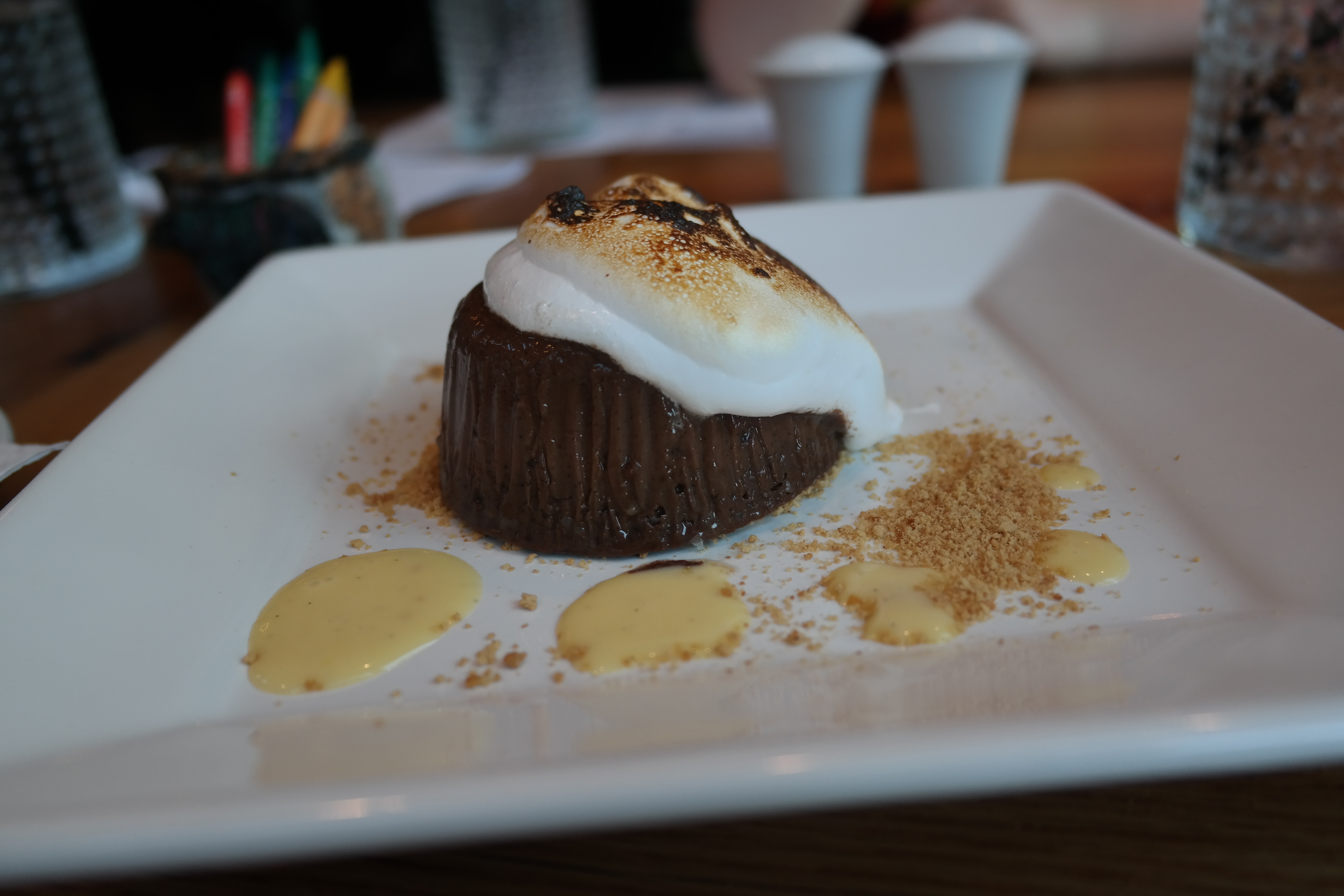 The S'mores had a cool creamy chocolate pudding bottom and a nicely toasted marshmallow top with sprinkles of graham cracker. It's a s'more all dressed up and fancy. The perfect end to a meal in town.