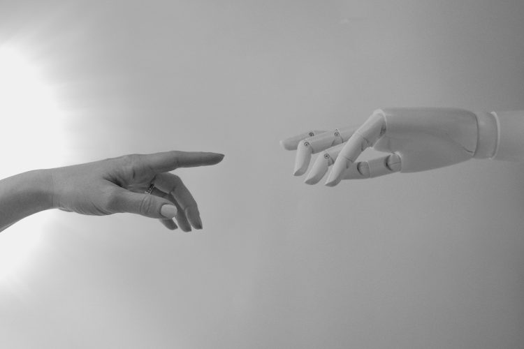 Learn How to Integrate GPT 3 API in C++   an image of a robot hand touching a human hand