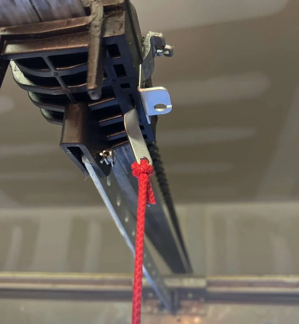 How to connect a stuck garage door trolley not catching