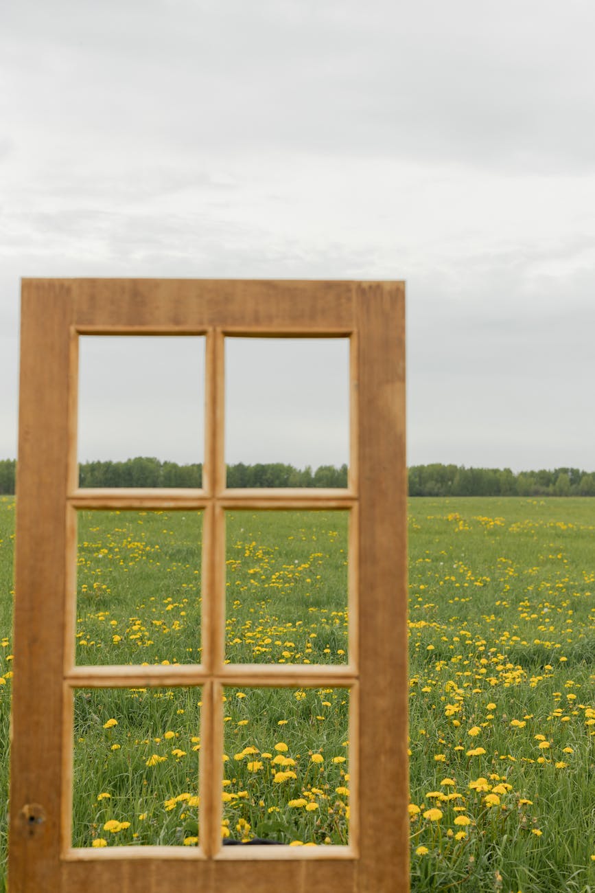 brown wooden framed glass window