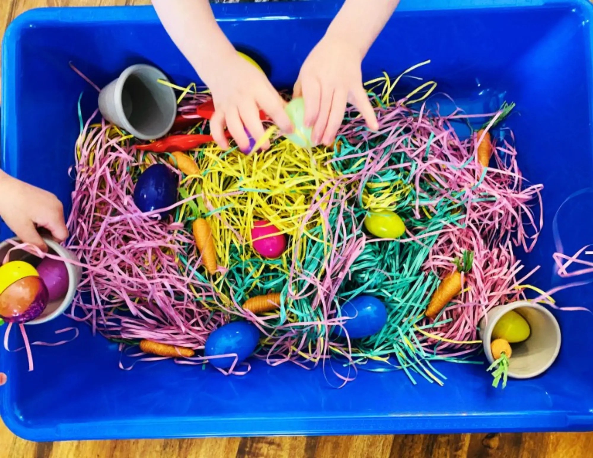 toddlers enjoying a simple eastry sensory bin