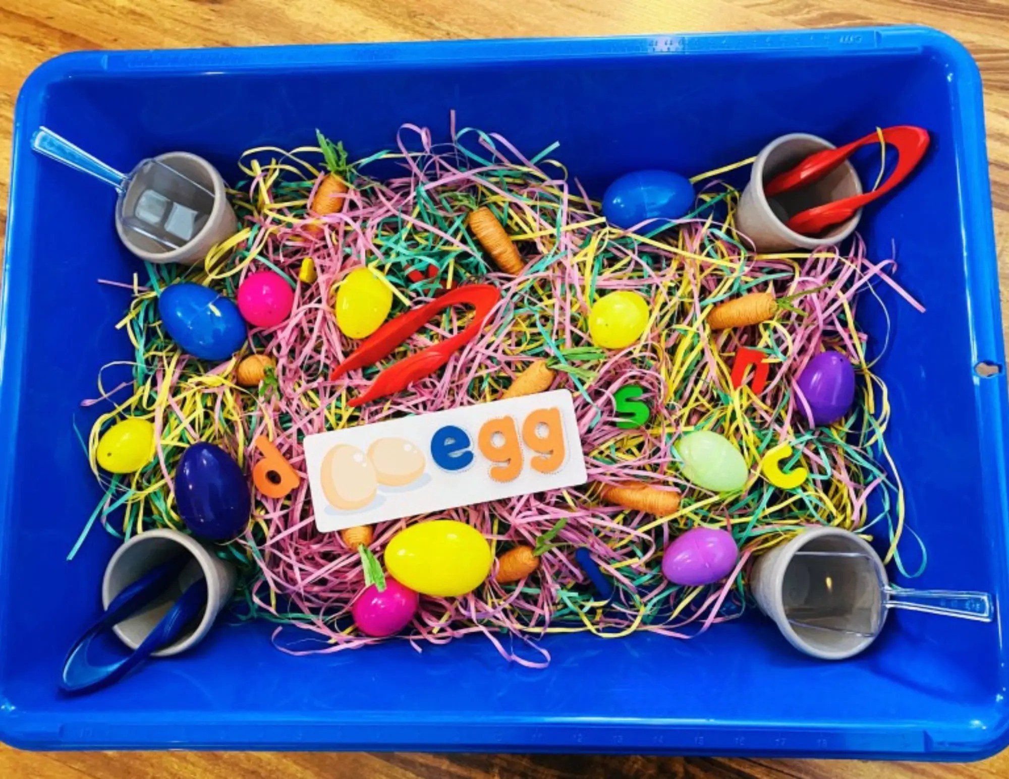 easter sensory bins with scoops and hidden letters