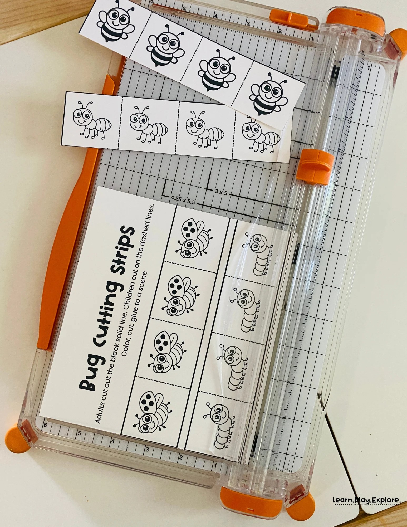 bug cutting strips being cut on a paper cutter