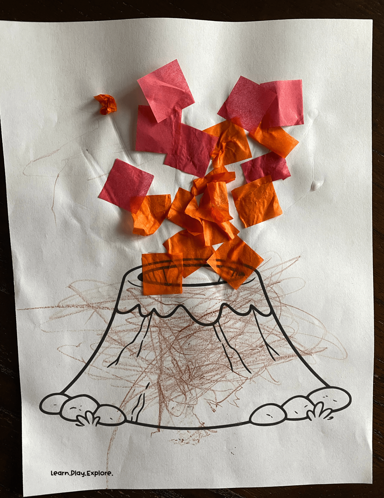 young toddler volcano craft with tissue paper and crayon
