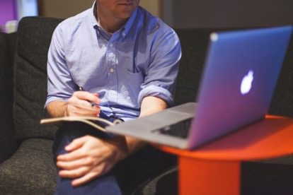 Men with Apple laptop