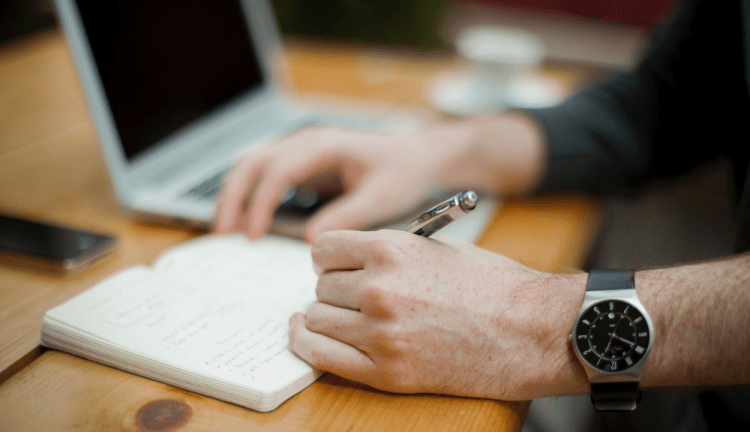 A man writing in a diary