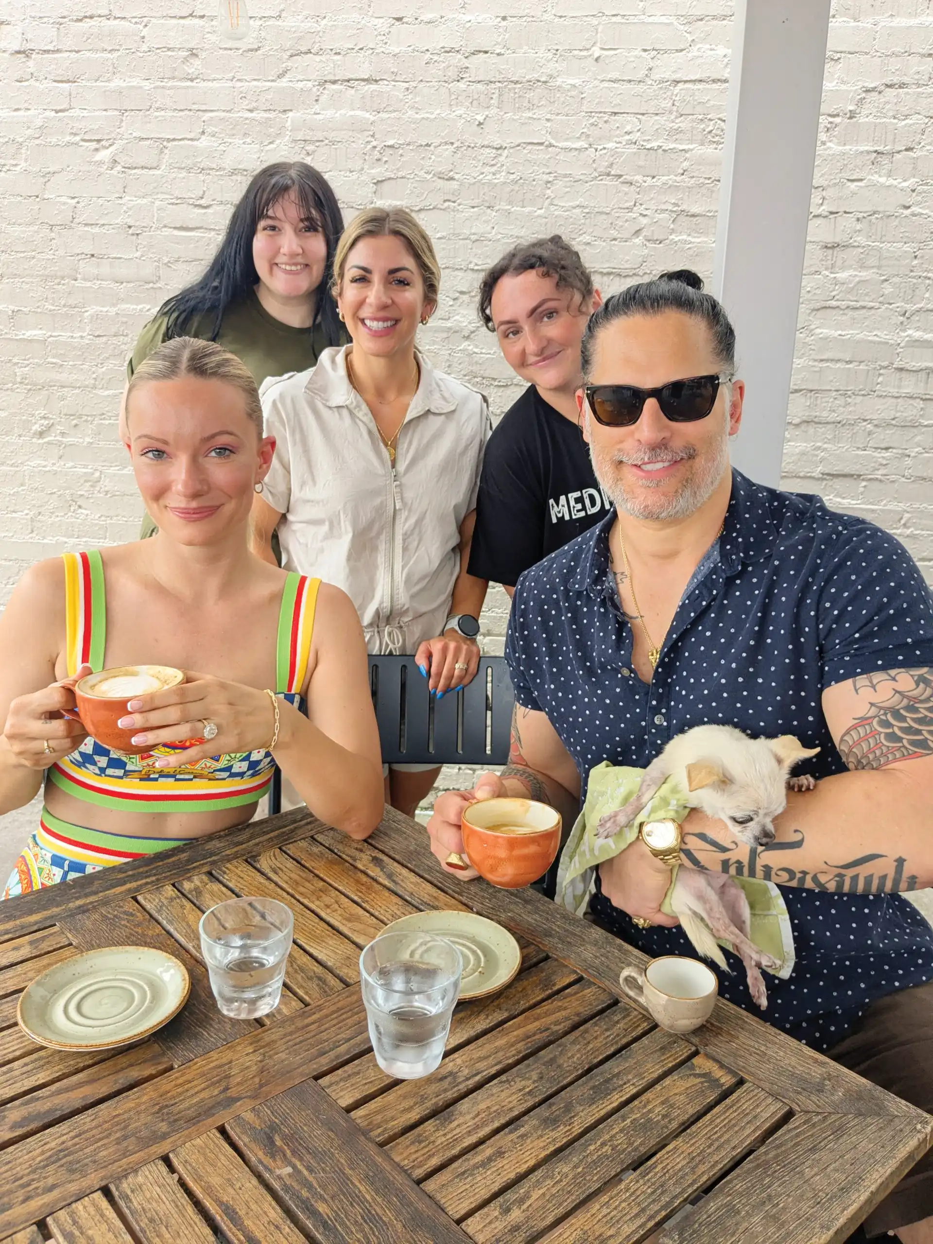 Joe Manganiello, Caitlin O’Connor and Bubbles pose with the Mediterra team — Chrissy Wheeler, Lilly DeVos and Nicole McLean introducing the cafe’s new Bubbles-inspired hot honey latte