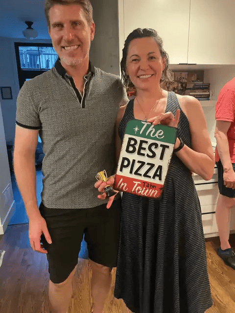 Jason Andrus and Lara Henke displaying the awards to be presented to the winning pizzerias. (Photo provided)