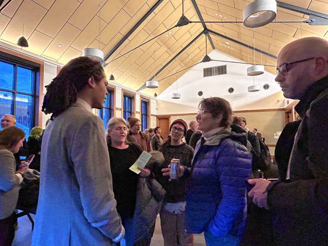 State Rep. Jonah Wheeler talks with Elizabeth Goodhue of Peterborough after a March listening session at Peterborough Town Library. Wheeler answered questions and received passionate, mixed feedback about his support for a bill that would allow government entities and businesses to separate the use of their bathrooms and locker rooms by biological sex.