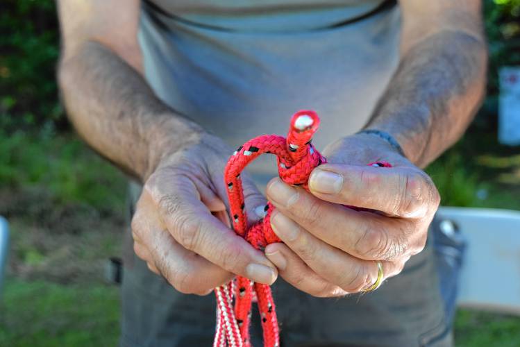 Gregory Majewski, of Jaffrey, shows the different types of rope that can be used in various situations during an event at the Monadnock Rod & Gun Club.