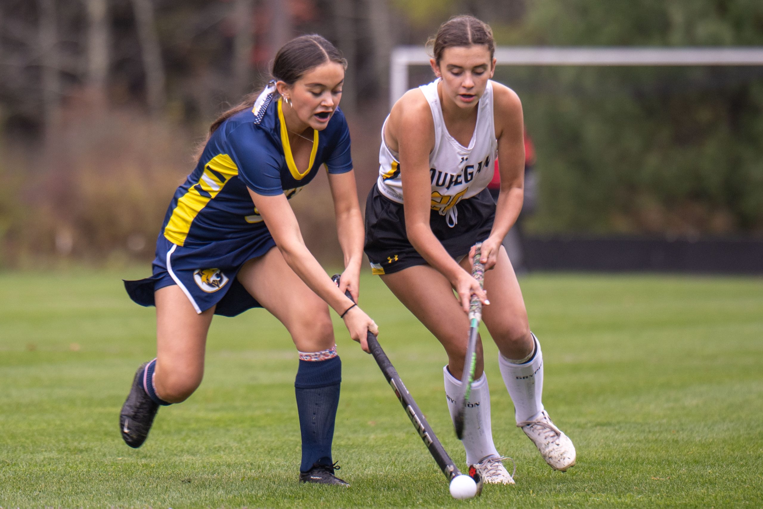 ConVal senior captain Makayla Lamothe fends off a Souhegan defender during the Cougar field hockey team's 5-0 loss to the visiting Sabers in Peterborough on Tuesday, Oct. 14, 2025.