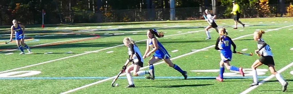 Boynton eight grader Reese Alix dribbles the ball, while South Meadow's Olivia Swinyer races to defend. Boynton's Havana Cormier follows the play.