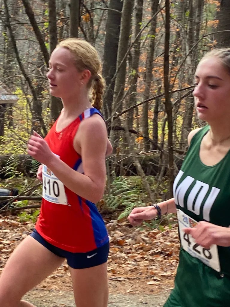 Mascenic Senior Erin O'Shea runs against a Mount Desert Island High School athlete at the New England Championship. COURTESY