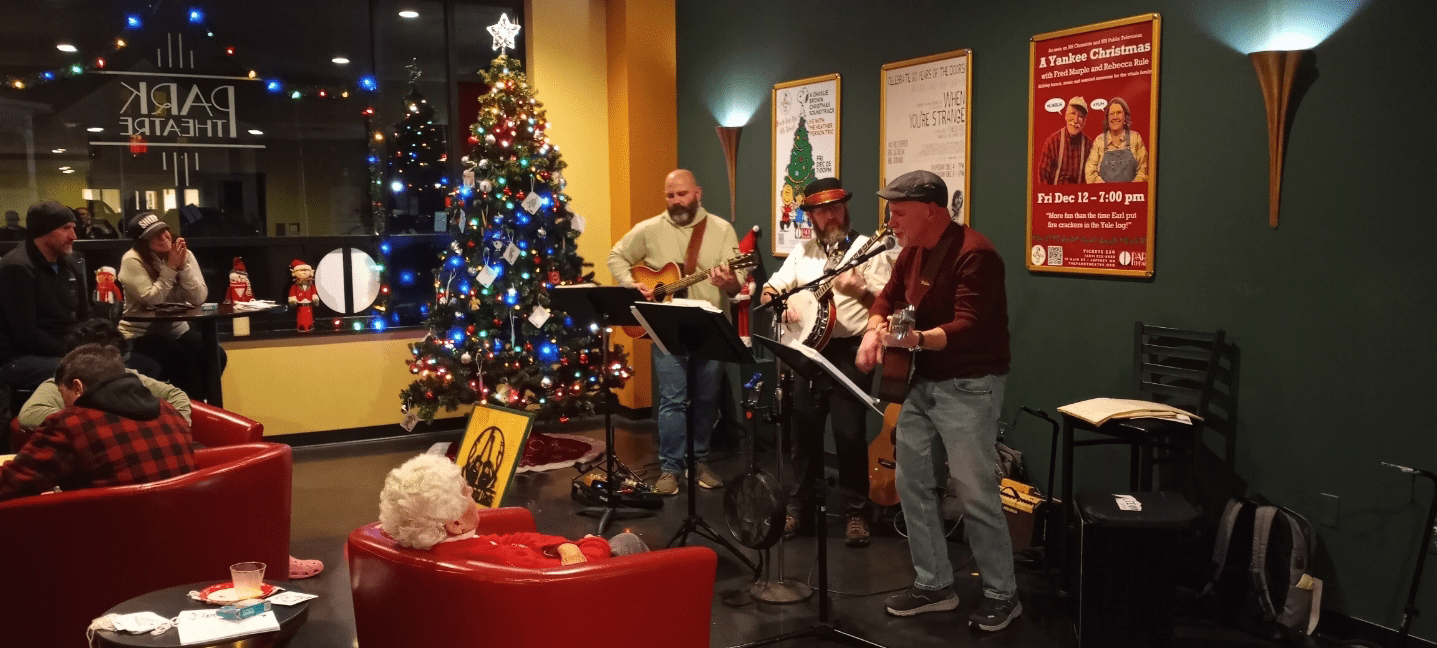 Local Jaffrey band The Grateful Dads, consisting of Brian Castiglioni, Paul Hutchinson, and Kevin Lennon, play at the Park Theatre's tree trimming party on Saturday. COURTESY
