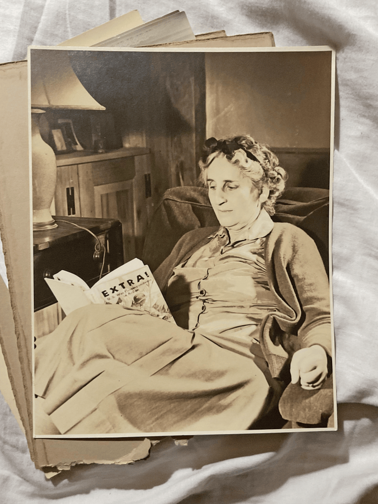 Elsa de Pierrefeu, reading in her cabin. The book title: "U.S War Correspondents in Action."