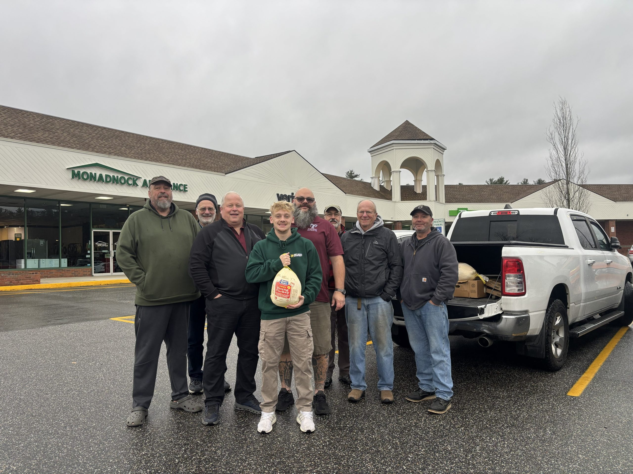 RAMS members left to right: Dave Trieb, Karl Pruter, Rob Clark, Josh Dipasquale, Mathew Mire, Dave Druin, Forbes Farmer, Jason Teague, with the turkeys they purchased for Rindge veterans. COURTESY