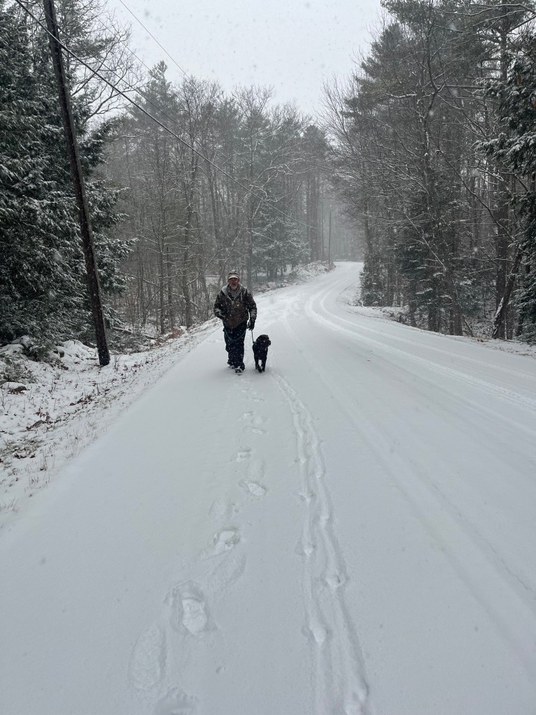 David Brogan and his dog Hattie Mae go for a snowy walk in Rindge. PEGGI BROGAN / Courtesy