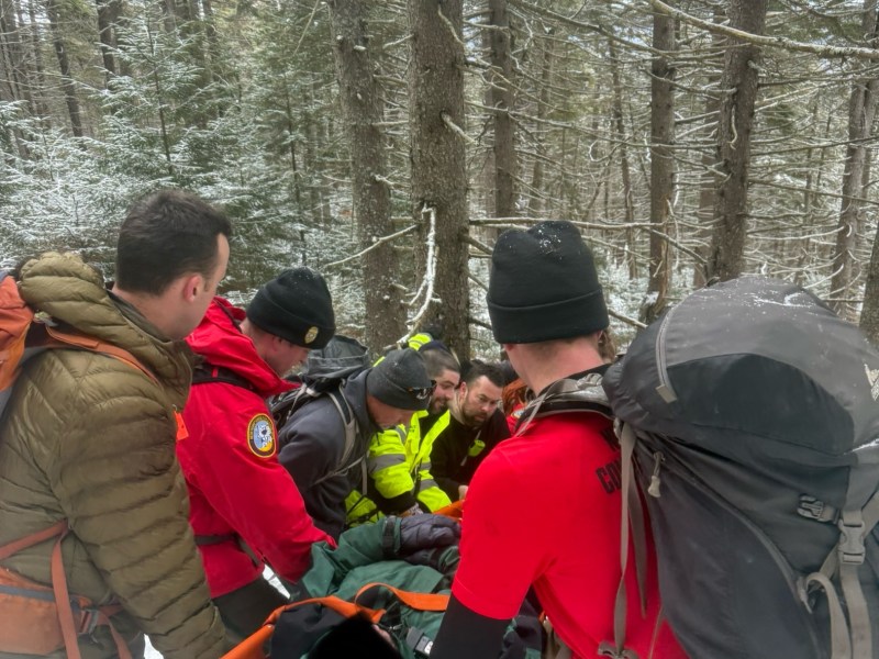 Rescuers carry Greg Austin of Greenfield down North Pack Monadnock after he fell and was injured while descending the mountain.
