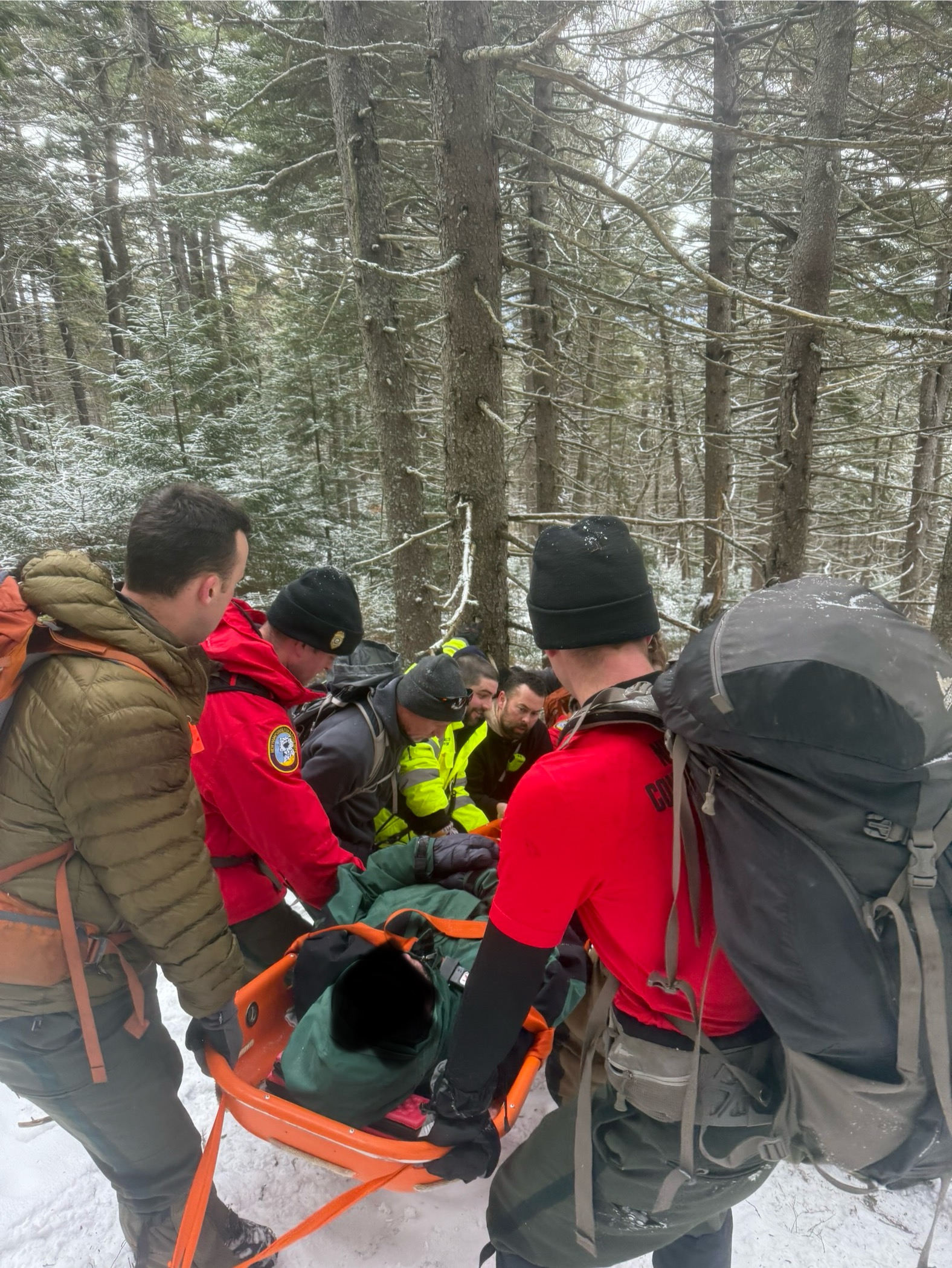 Rescuers carry Greg Austin of Greenfield down North Pack Monadnock after he fell and was injured while descending the mountain.