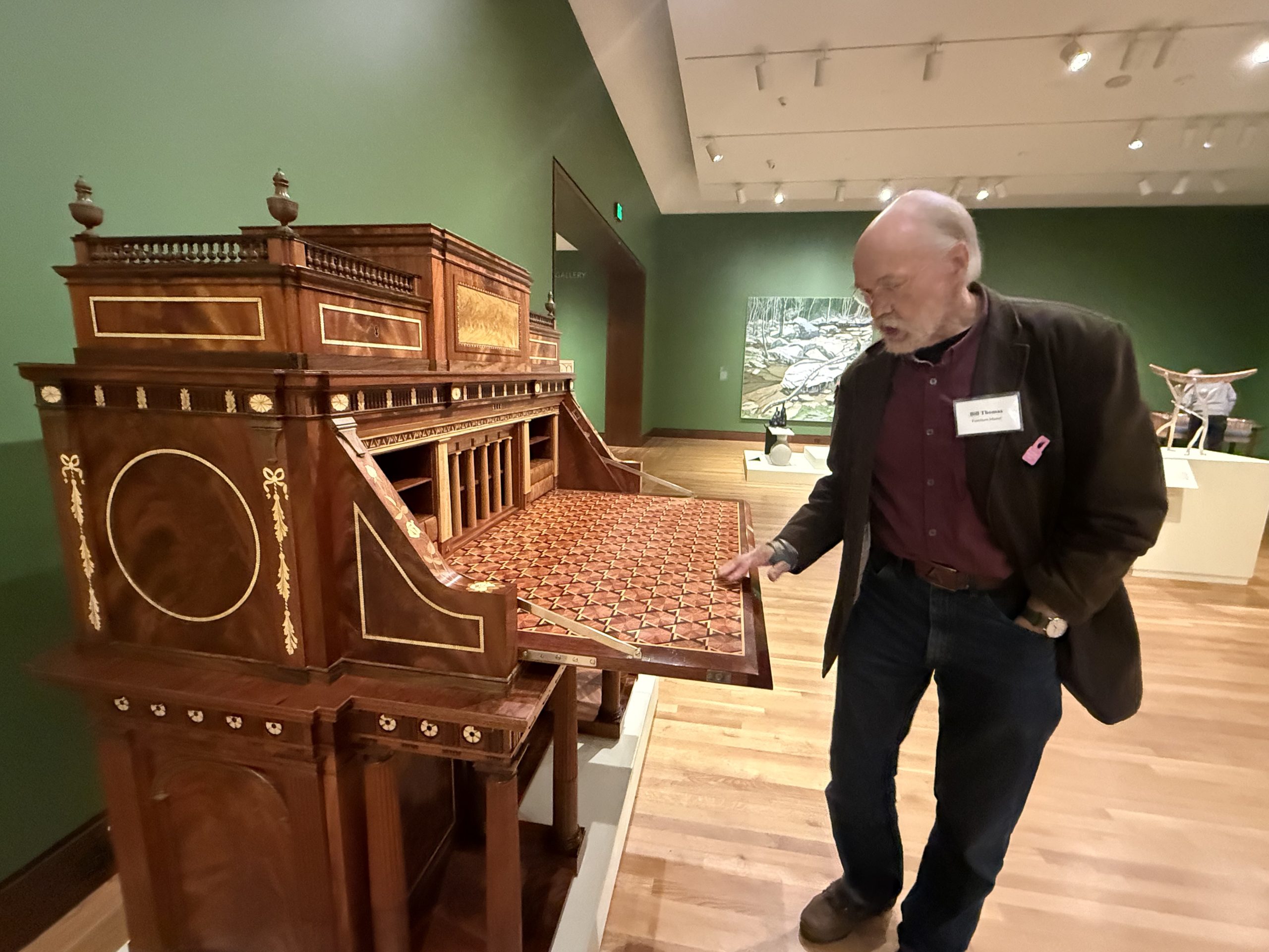 Bill Thomas of Rindge demonstrates the hidden compartments and secrets of his desk. ASHLEY SAARI / Ledger-Transcript