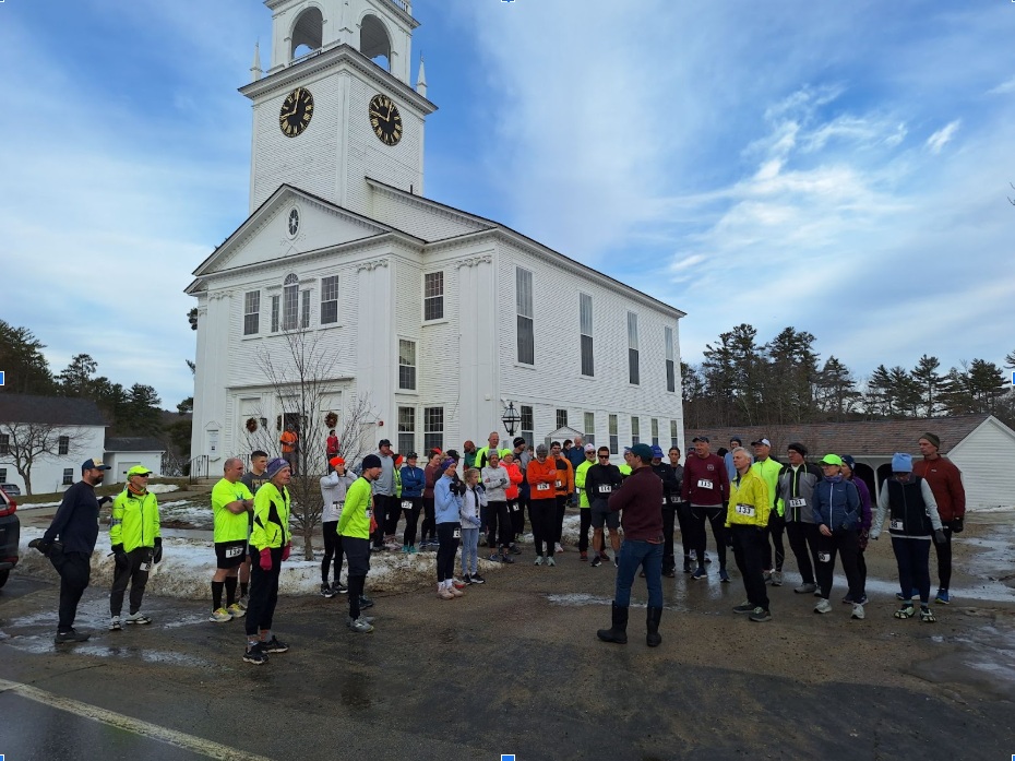 Racers get final race instructions before toeing up to the start line.