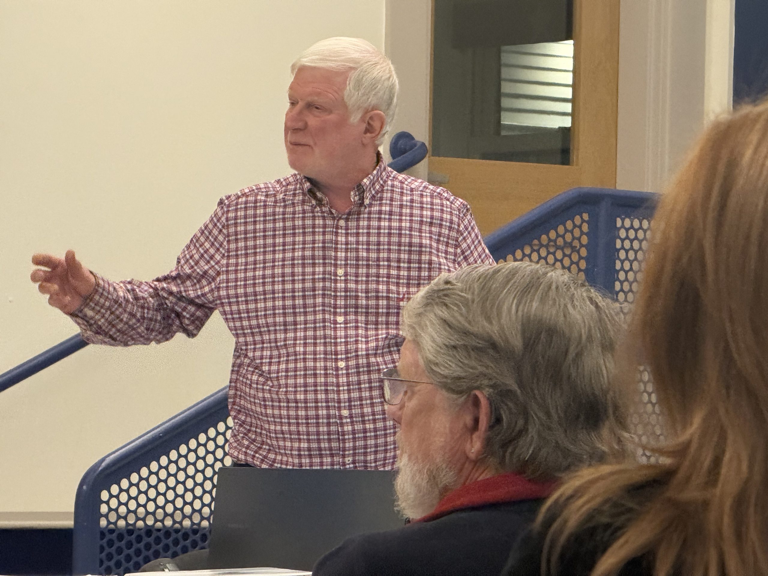 Planning Board Chair Dane Rota speaks to a crowded room during a public hearing Wednesday. ASHLEY SAARI / Ledger-Transcript