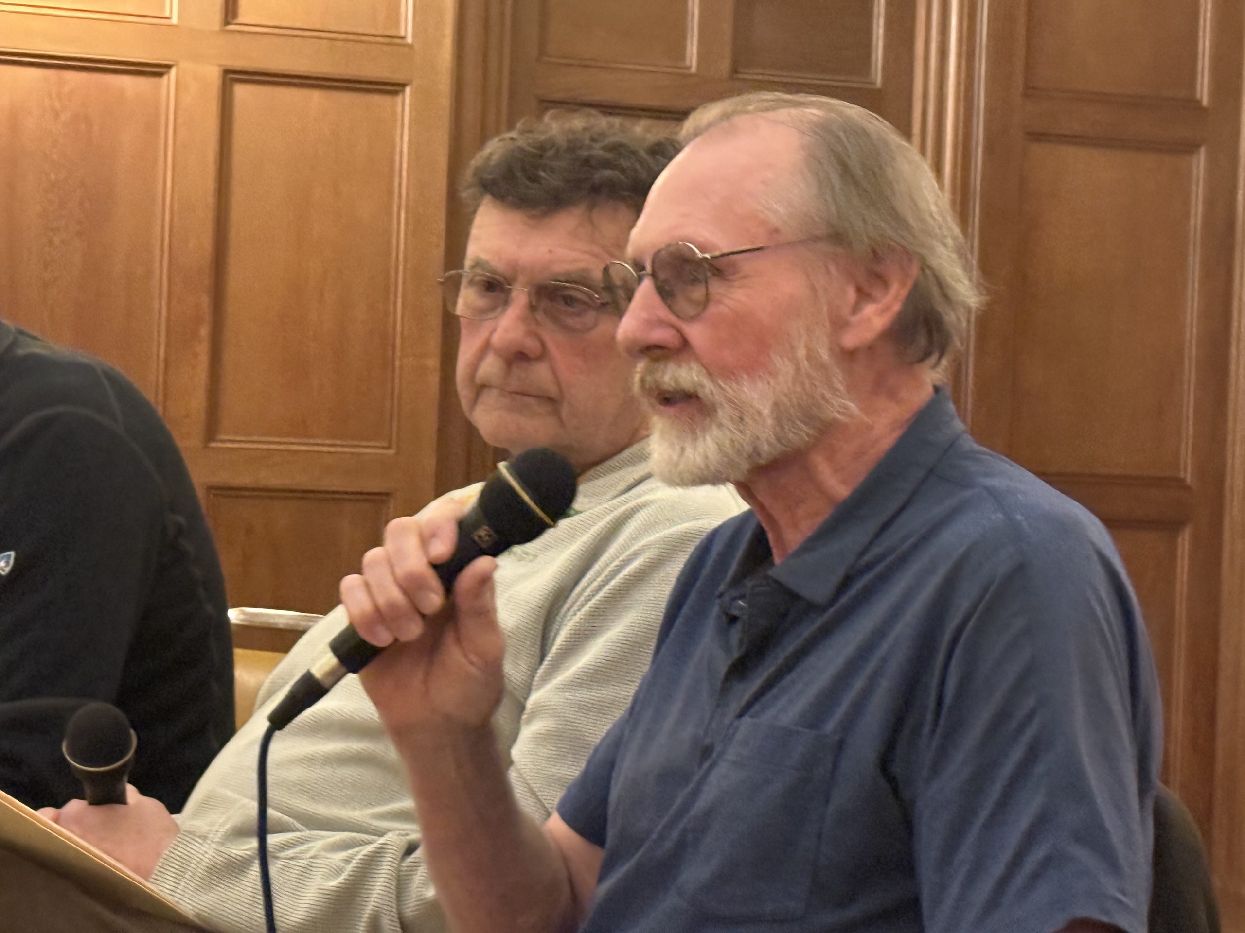 Greg Blake and Bruce Tucker speak on initiatives to save energy costs at a Community Conversations in Peterborough on Thursday. ASHLEY SAARI / Ledger-Transcript