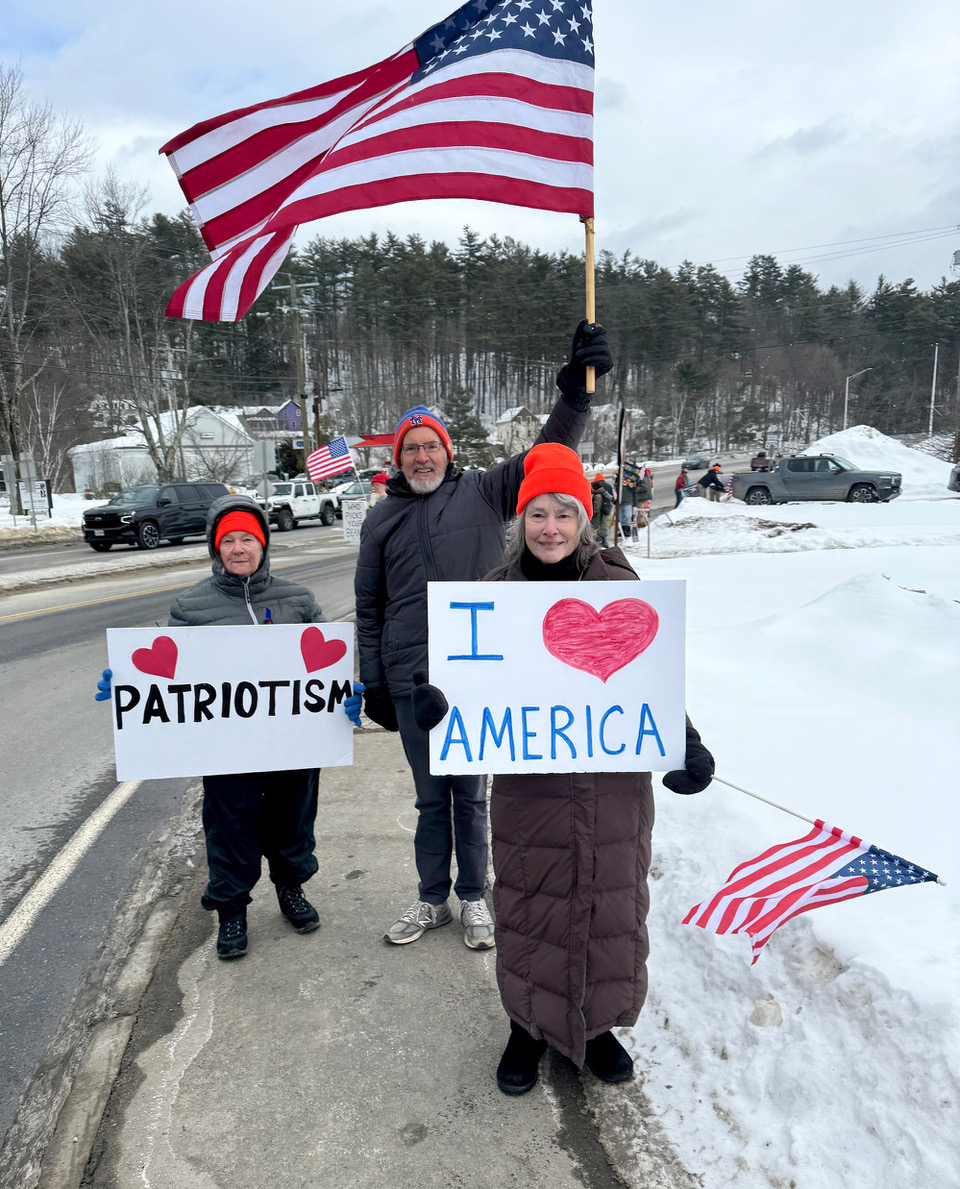 From the left, Kath Allen and Tom Burgess of Peterborough and Sandy Taylor of Hancock at Saturday's pro-democracy vigil in Peterborough.