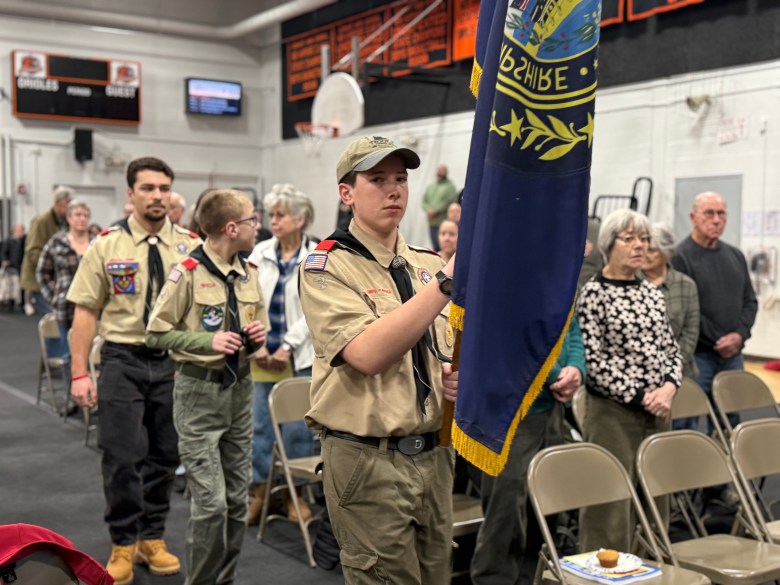 Scouts Ethan Hutchinson, Lee Backstrom and Jacob Levesque present the state flag at the start of Town Meeting. ASHLEY SAARI / Ledger-Transcript