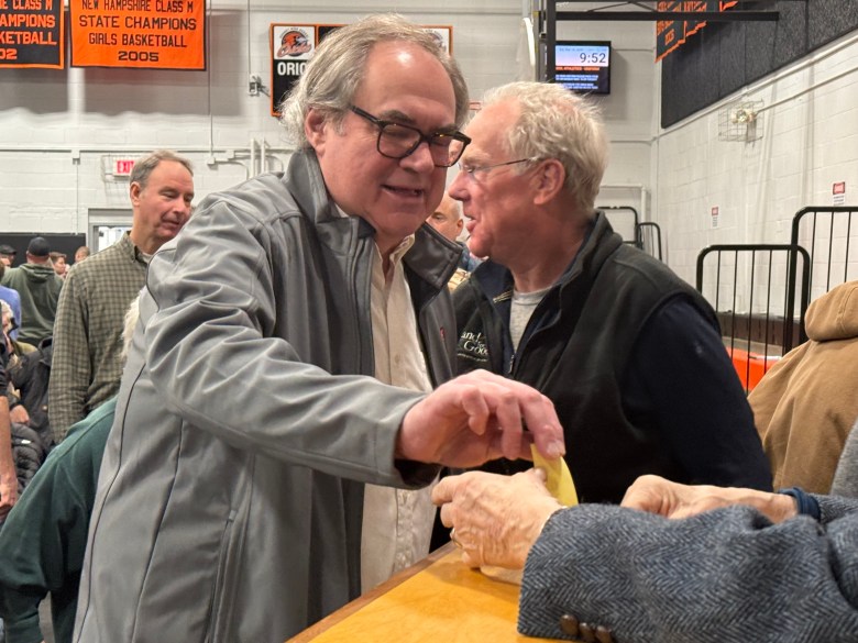 Resident Steve Jackson casts his vote on whether or not the town should build an addition to the fire station. ASHLEY SAARI / Ledger-Transcript