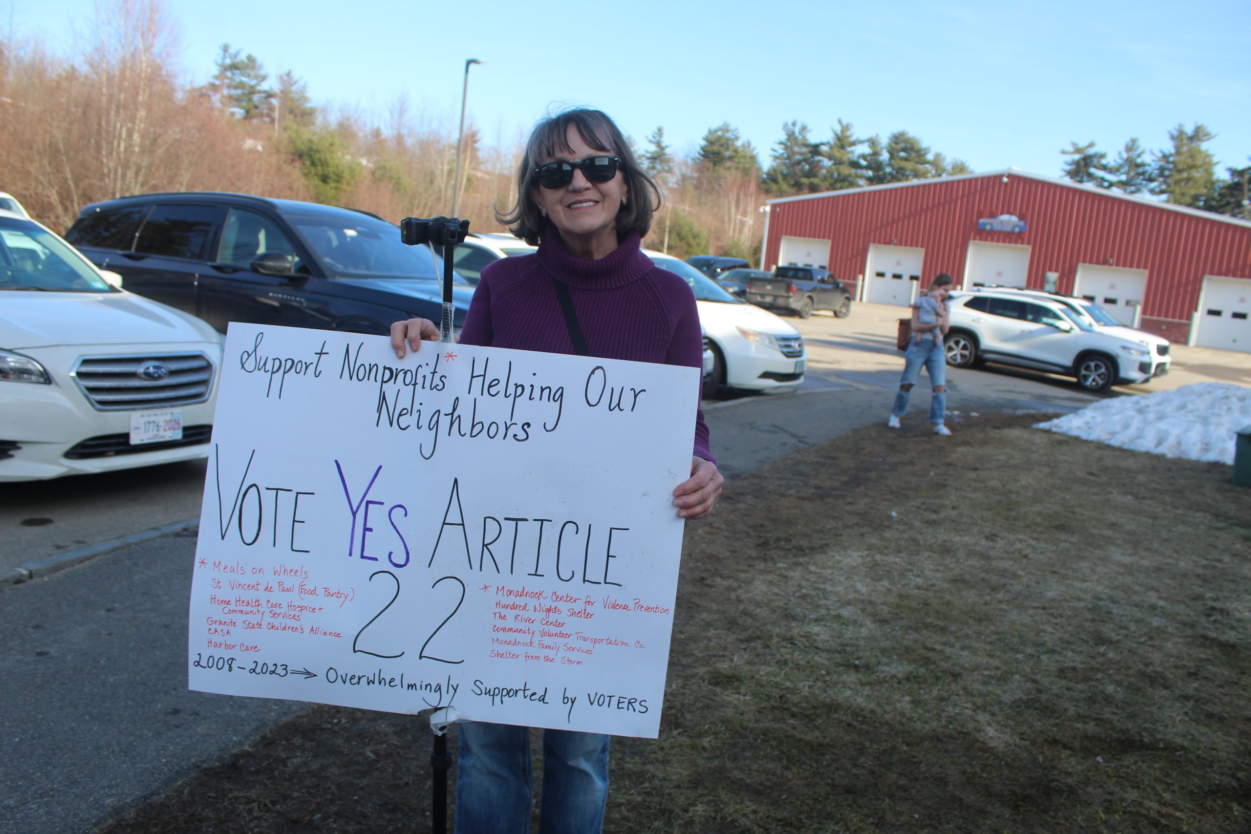 Margaret Lee campaigns at the New Ipswich polls in support of a petition article to help fund local social service organizations. ASHLEY SAARI / Ledger-Transcript