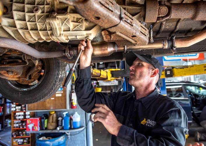 Jeff Chaplain, owner of Village Street Garage in Penacook, works on a vehicle on Thursday, October 8, 2020. Chaplain is an indepedent car repair operation but has no problem with the dealerships. He can get all the techinical data he needs and feels there is work for everyone.