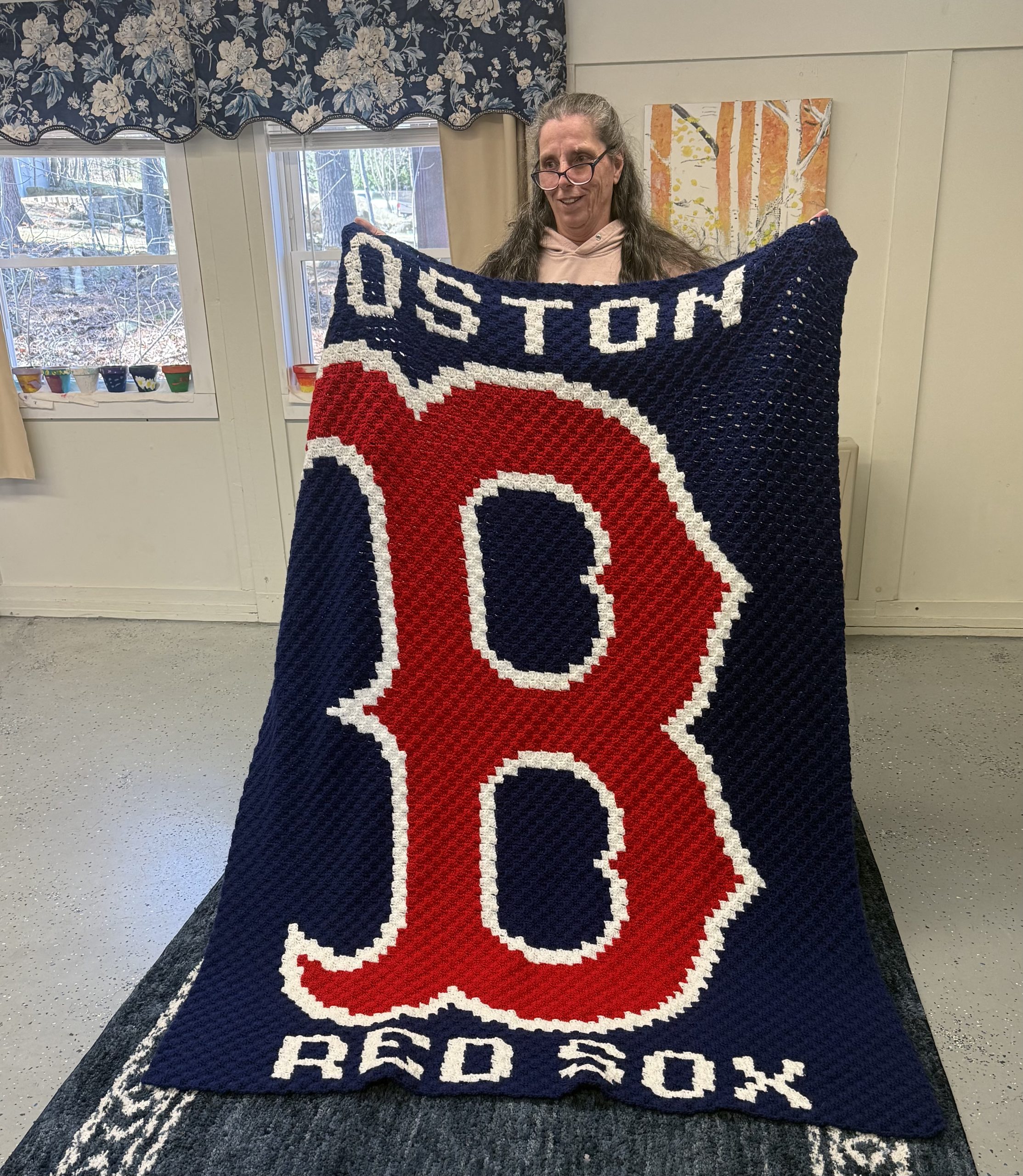 Lisa Miller of Jaffrey holds up her recently finished crafting project.